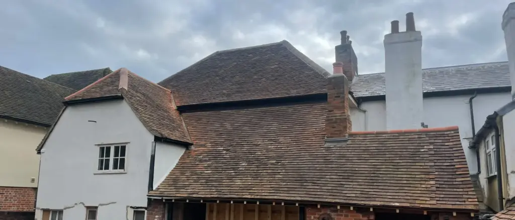 Weathered tile roof repair property